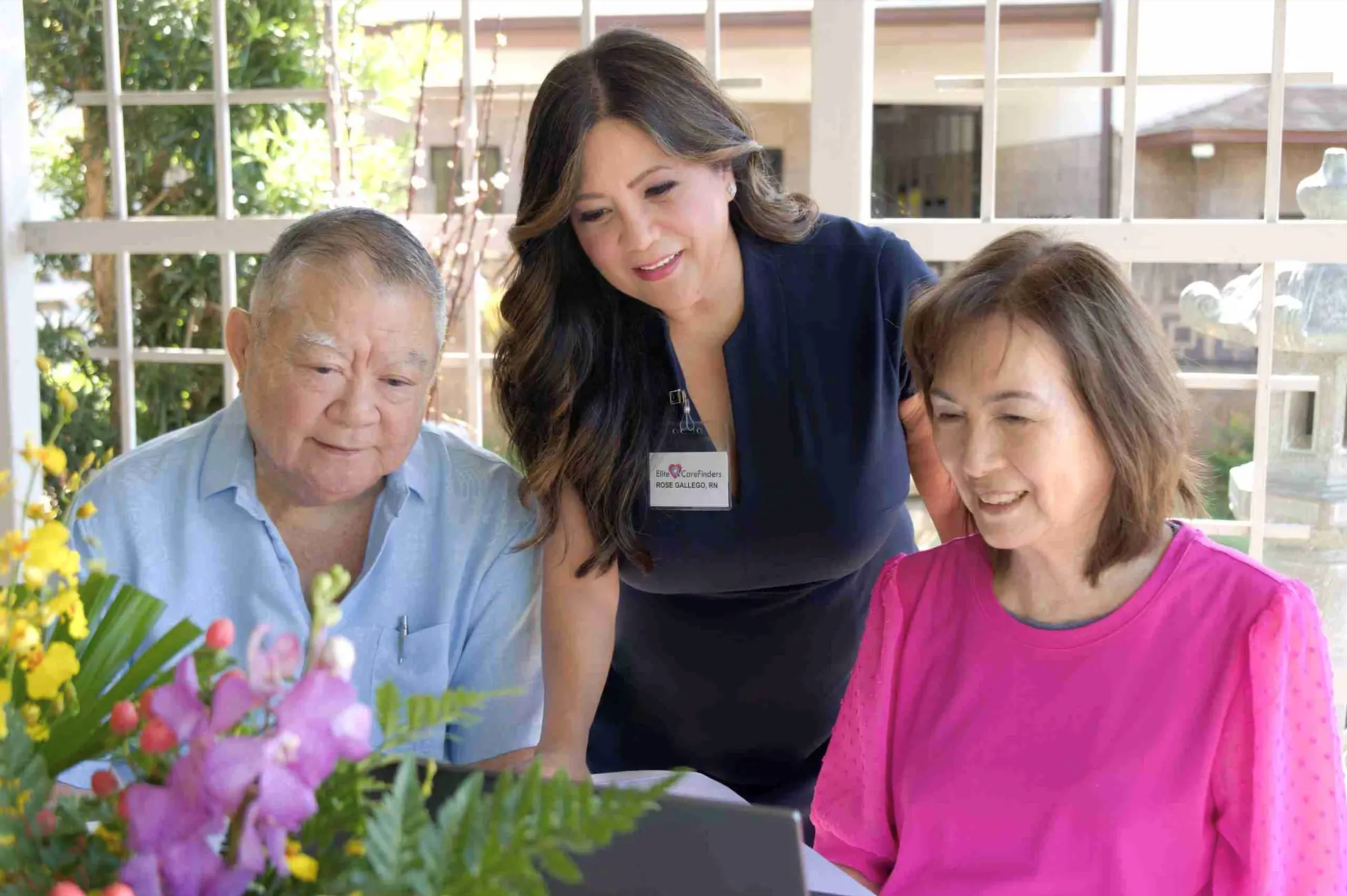 Rose Gallego, RN, Owner and Founder of Elite CareFinders, meeting with a senior couple